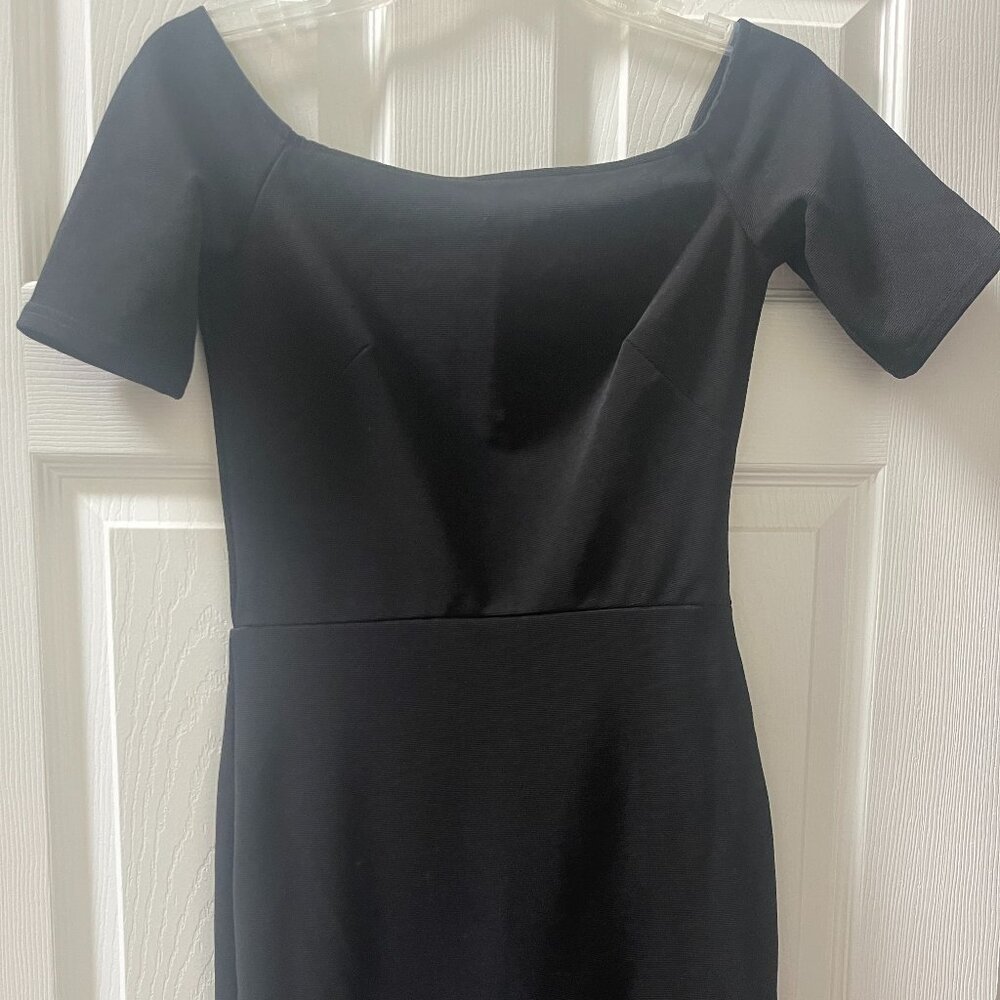 Adorable short black dress w/ruffle bottom by OML - size S